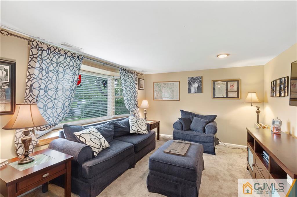 63 Daniel Street Carteret, NJ 07008 - Photo 8 of 20 a living room with furniture and a large window