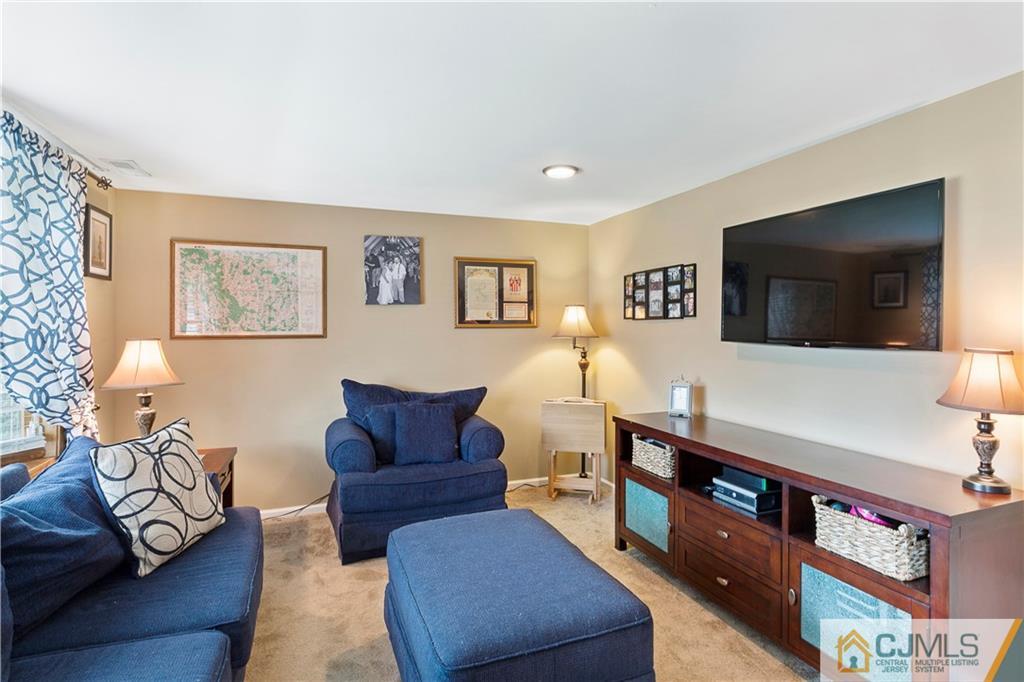 63 Daniel Street Carteret, NJ 07008 - Photo 9 of 20 a living room with furniture and a flat screen tv