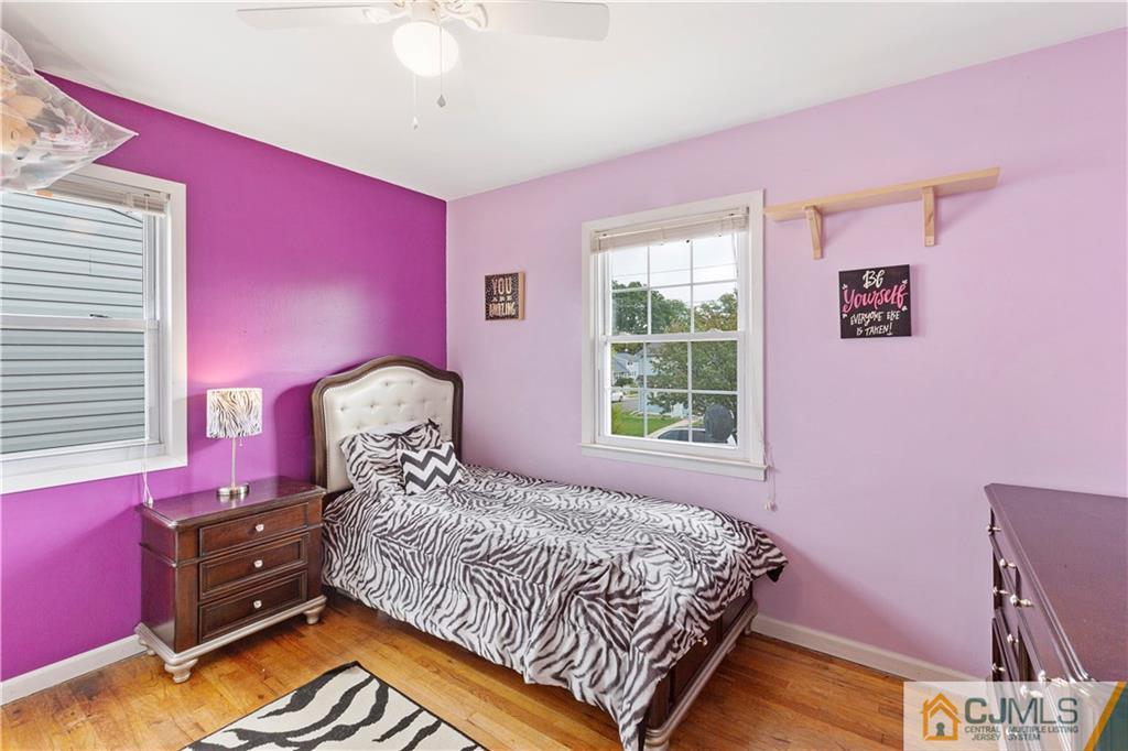 63 Daniel Street Carteret, NJ 07008 - Photo 10 of 20 a bedroom with a bed and a window