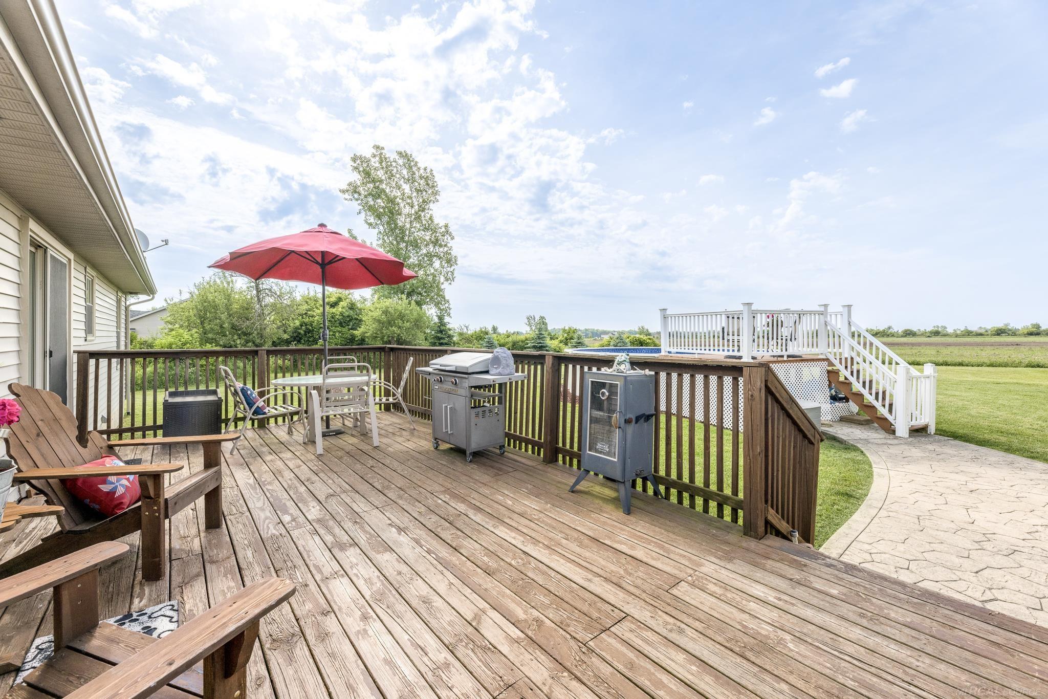 5674 Galbraith Line Road Croswell, MI 48422 - Photo 28 of 34 Spacious Backyard Deck