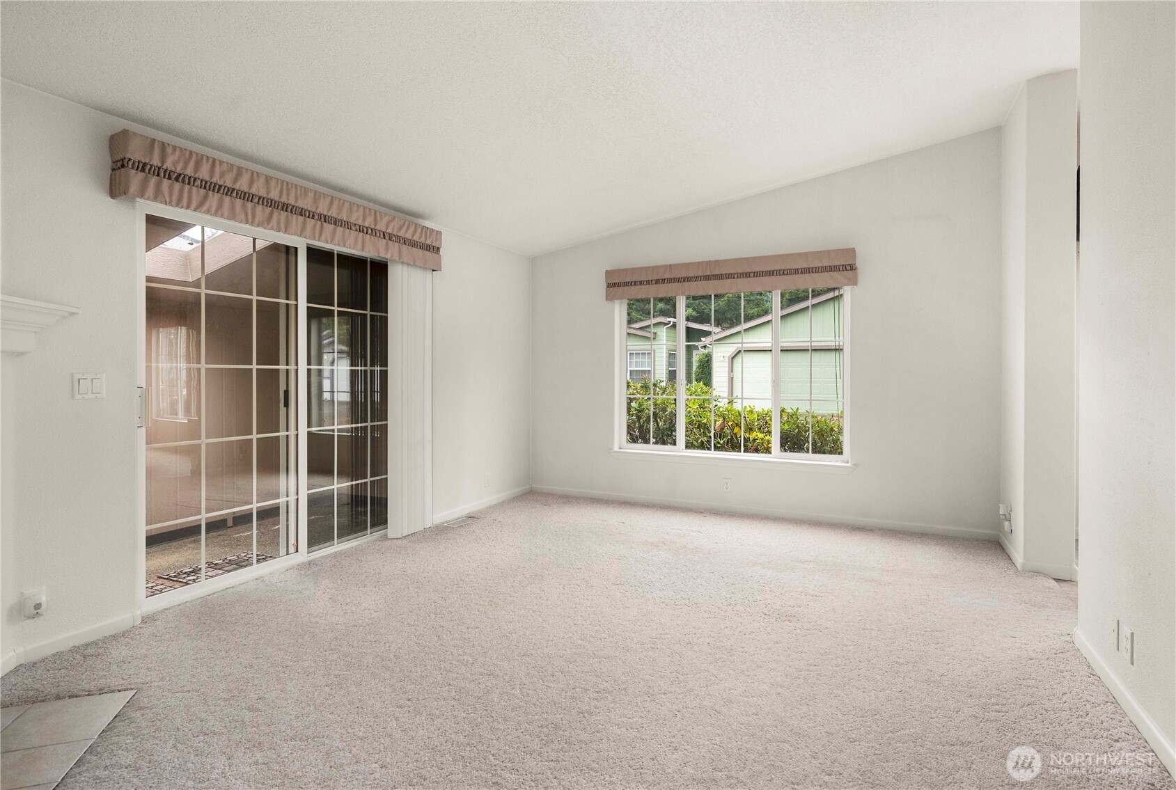 9806 196th Street East Graham, WA 98338 - Photo 18 of 31 a view of an empty room with a window
