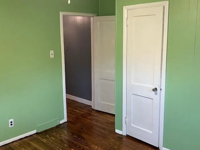 a white toilet and tub sitting next to a bathroom sink