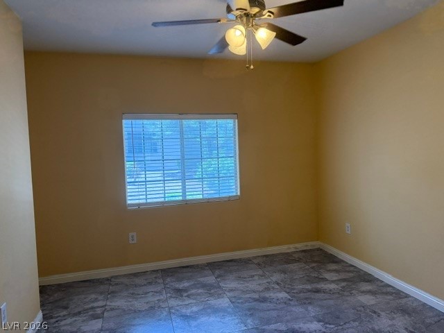 3318 North Decatur Boulevard, Unit 1163 Las Vegas, NV 89130 - Photo 21 of 35 A window-lit room features durable tile flooring and an overhead fan for comfort.