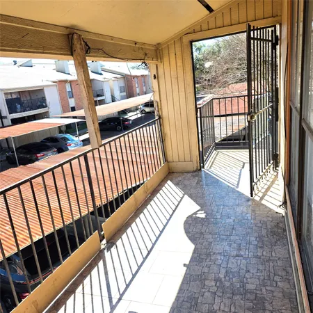 a kitchen with a sink a stove and cabinets