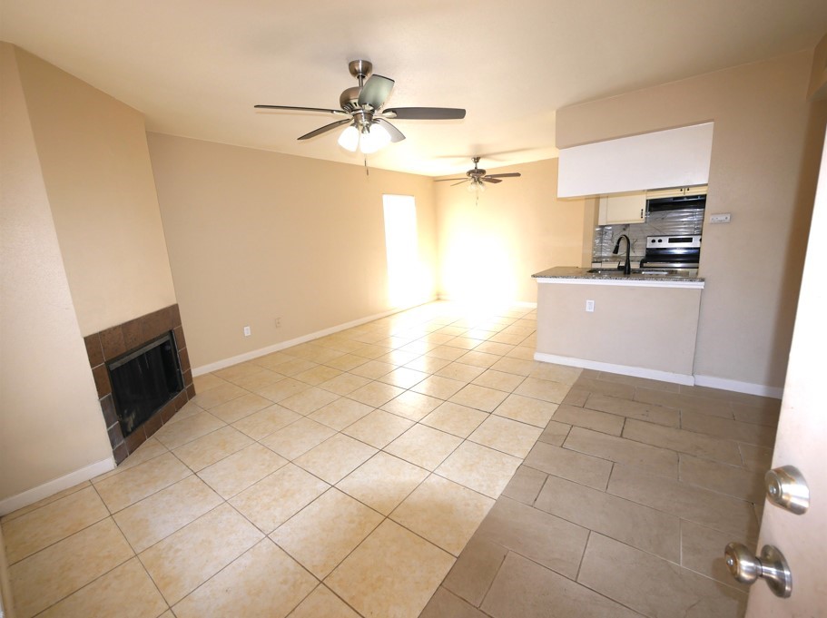 10100 South Gessner Road, Unit 202 Houston, TX 77071 - Photo 2 of 9 a kitchen with a sink a stove and cabinets