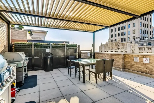 a balcony with furniture and a view of lake