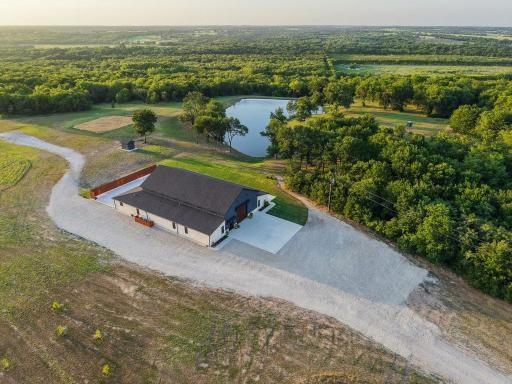 4251 Refuge Road Sherman, TX 75092 - Photo 28 of 40 an aerial view of a house with a yard and lake view