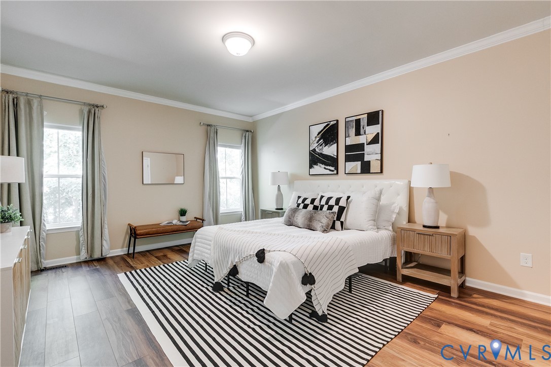 7538 South Franklins Way Quinton, VA 23141 - Photo 23 of 48 a bedroom with a bed and wooden floor