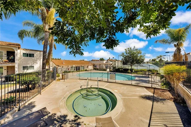 swimming pool view with a seating space