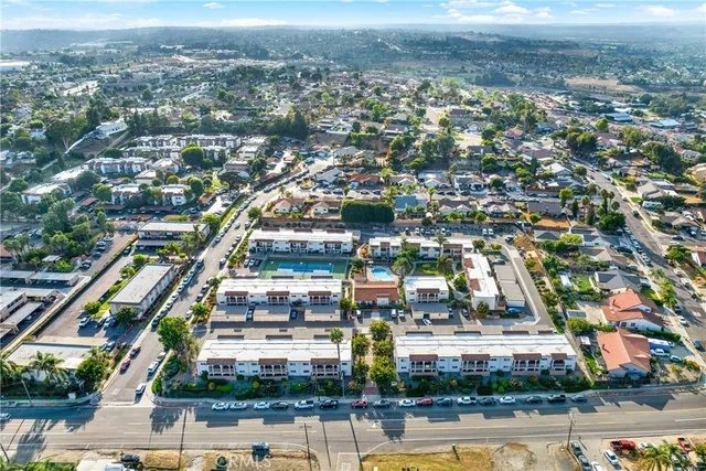 an aerial view of houses with outdoor space