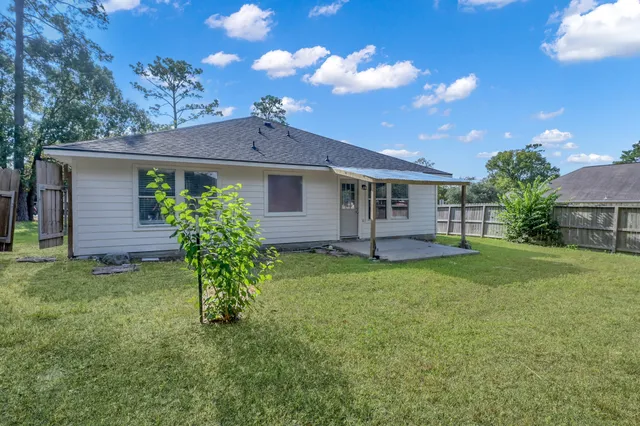 a view of a yard with a tree