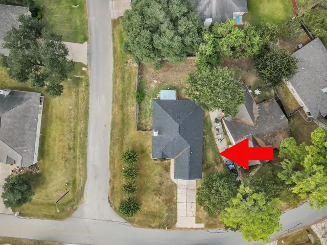 an aerial view of residential houses with outdoor space