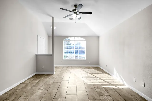 a view of an empty room and window