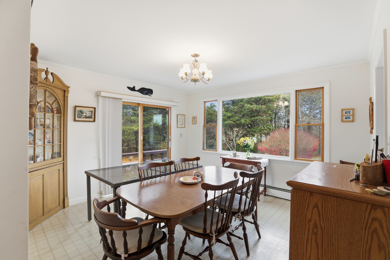 10 Pease Point Road Edgartown, MA 02539 - Photo 15 of 21 a view of a dining room with furniture large windows and wooden floor