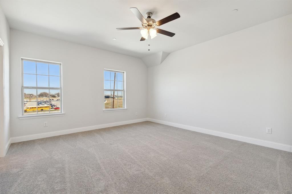 6028 Bursey Road Watauga, TX 76148 - Photo 17 of 27 an empty room with a window and a ceiling fan