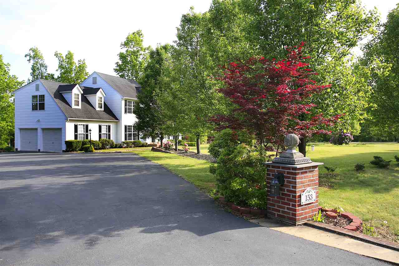 153 Deerview Road Keswick, VA 22947 - Photo 11 of 31 a front view of a house with a yard and fountain
