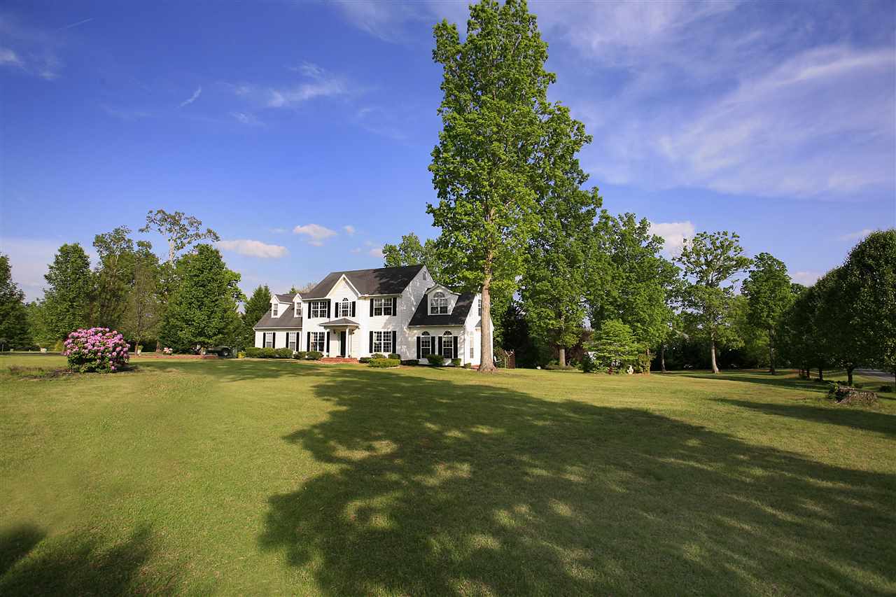 153 Deerview Road Keswick, VA 22947 - Photo 13 of 31 a front view of a house with a yard and trees