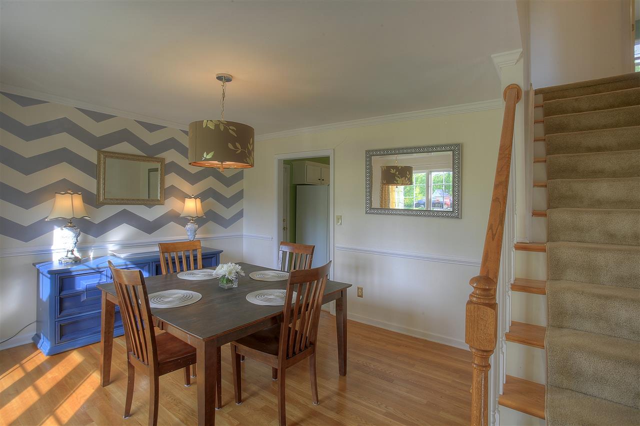 153 Deerview Road Keswick, VA 22947 - Photo 14 of 31 a view of a dining room with furniture and wooden floor
