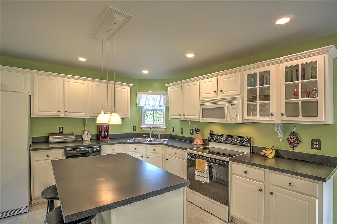 153 Deerview Road Keswick, VA 22947 - Photo 17 of 31 a kitchen with stainless steel appliances granite countertop a stove a sink a refrigerator a center island and a cabinets