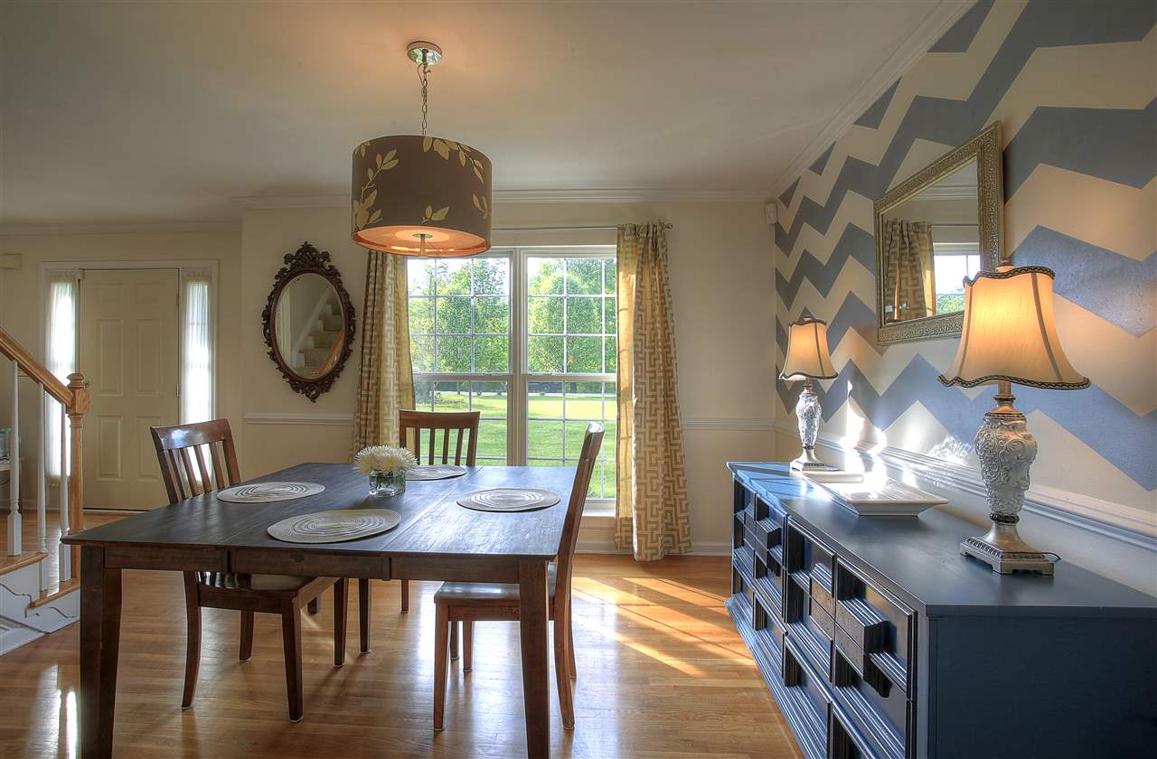 153 Deerview Road Keswick, VA 22947 - Photo 18 of 31 a view of a dining room with furniture and wooden floor