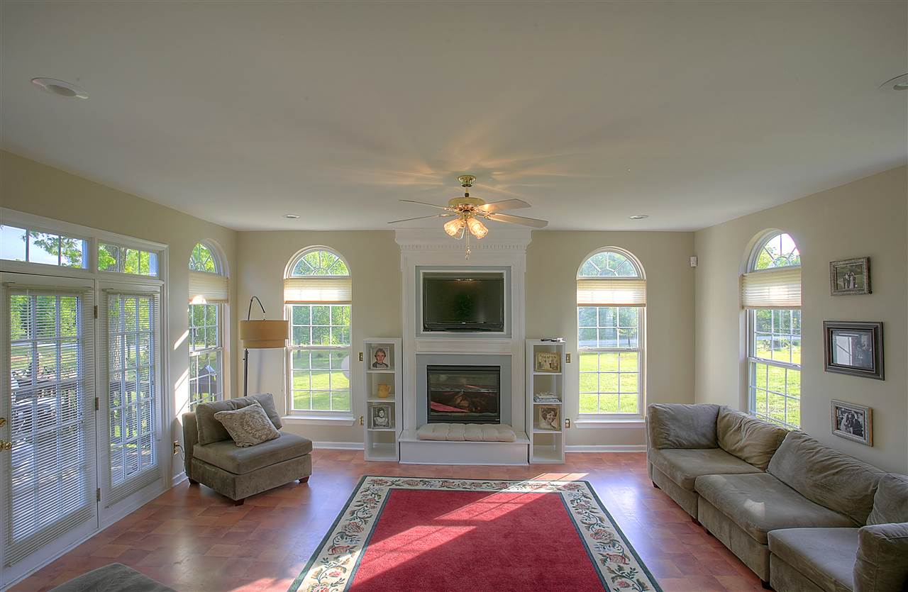 153 Deerview Road Keswick, VA 22947 - Photo 19 of 31 a living room with furniture and a fireplace