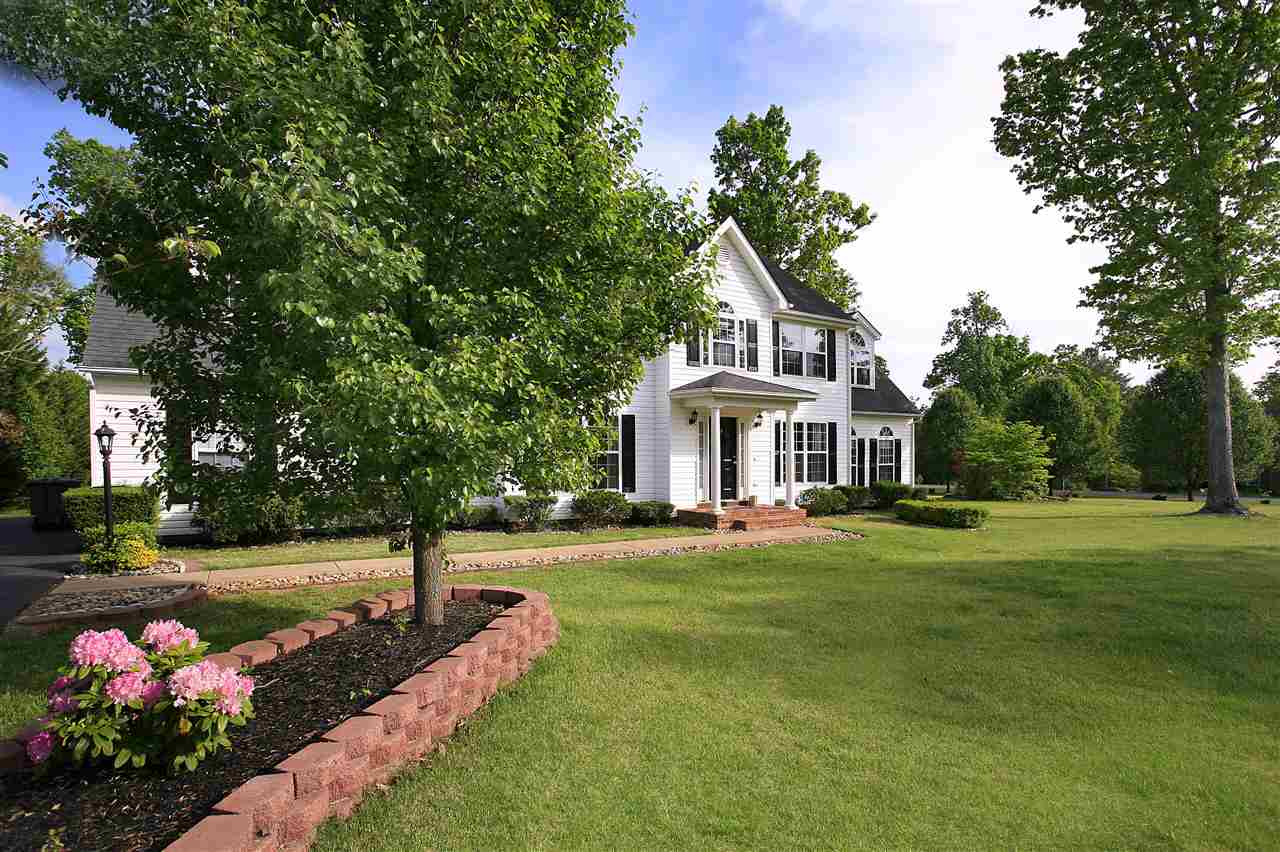 153 Deerview Road Keswick, VA 22947 - Photo 2 of 31 a front view of a house with a garden