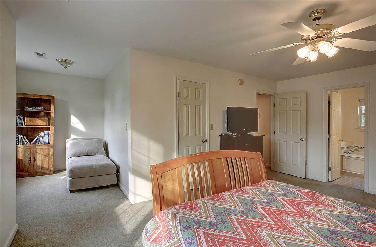 153 Deerview Road Keswick, VA 22947 - Photo 23 of 31 a bedroom with a bed and a couch