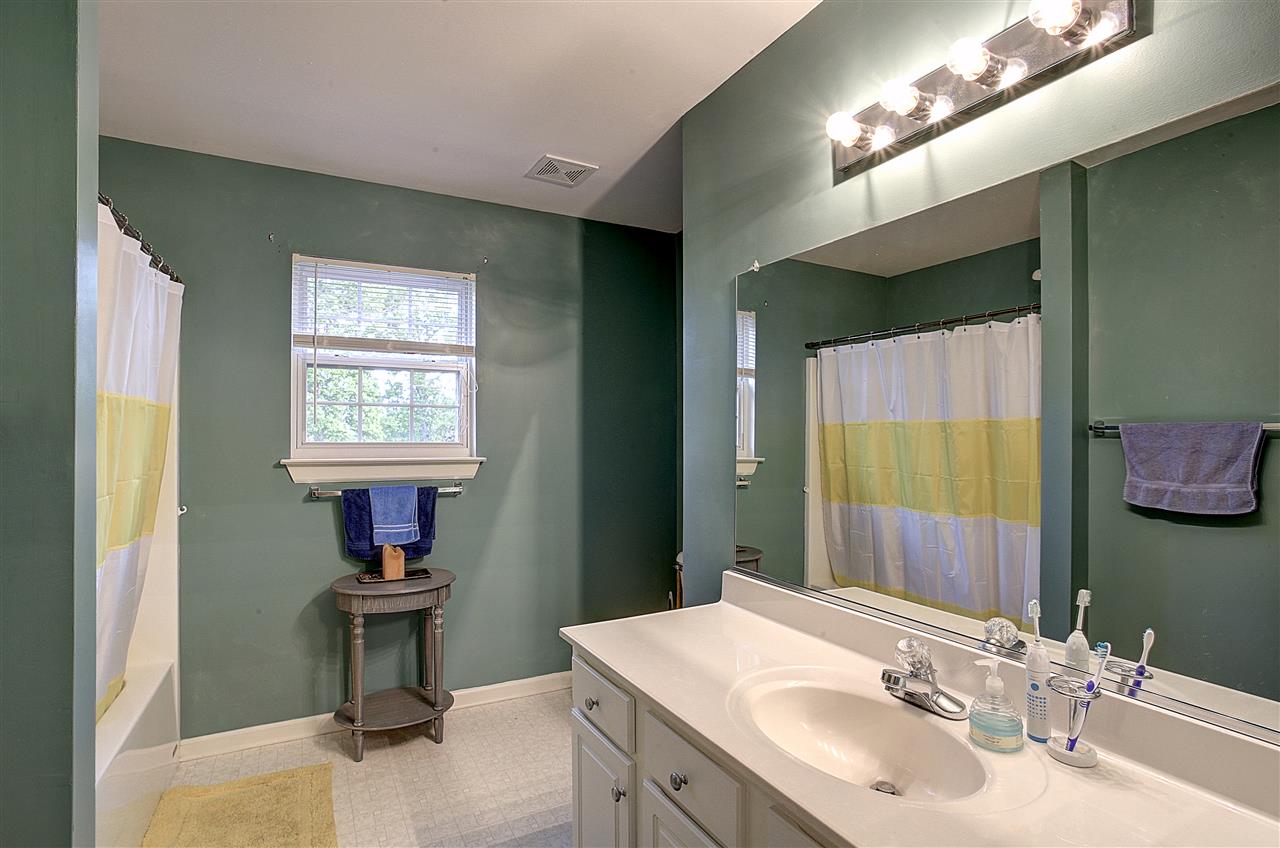 153 Deerview Road Keswick, VA 22947 - Photo 27 of 31 a bathroom with a sink and a mirror