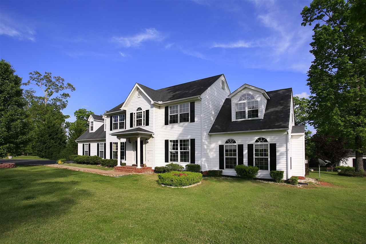 153 Deerview Road Keswick, VA 22947 - Photo 3 of 31 a front view of a house with a garden