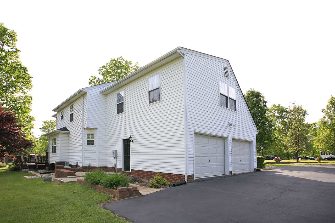 153 Deerview Road Keswick, VA 22947 - Photo 7 of 31 a view of a house with a yard and garage