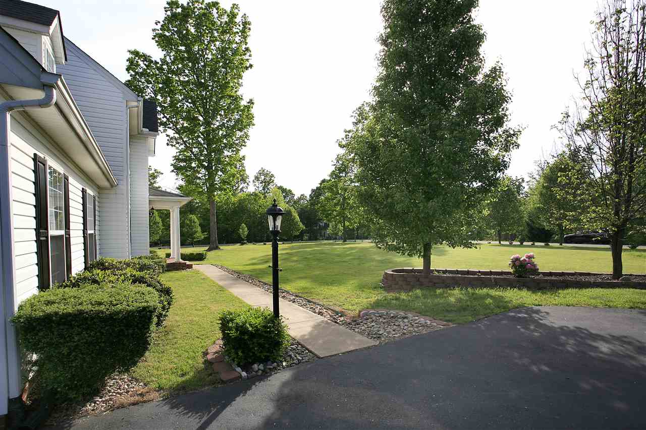 153 Deerview Road Keswick, VA 22947 - Photo 9 of 31 a front view of a house with garden