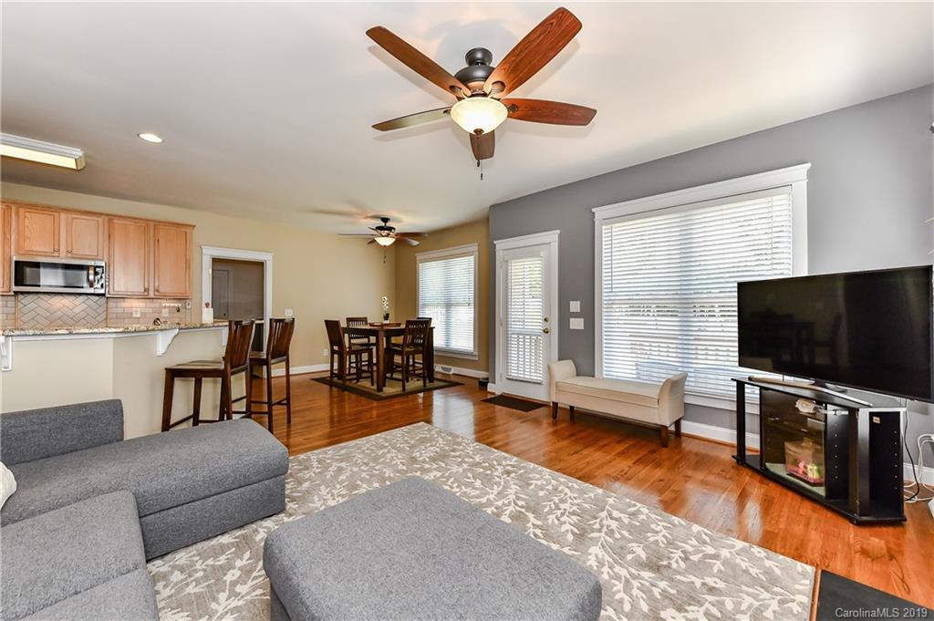 1036 Hunters Run Drive Tega Cay, SC 29708 - Photo 19 of 35 a living room with furniture and a flat screen tv