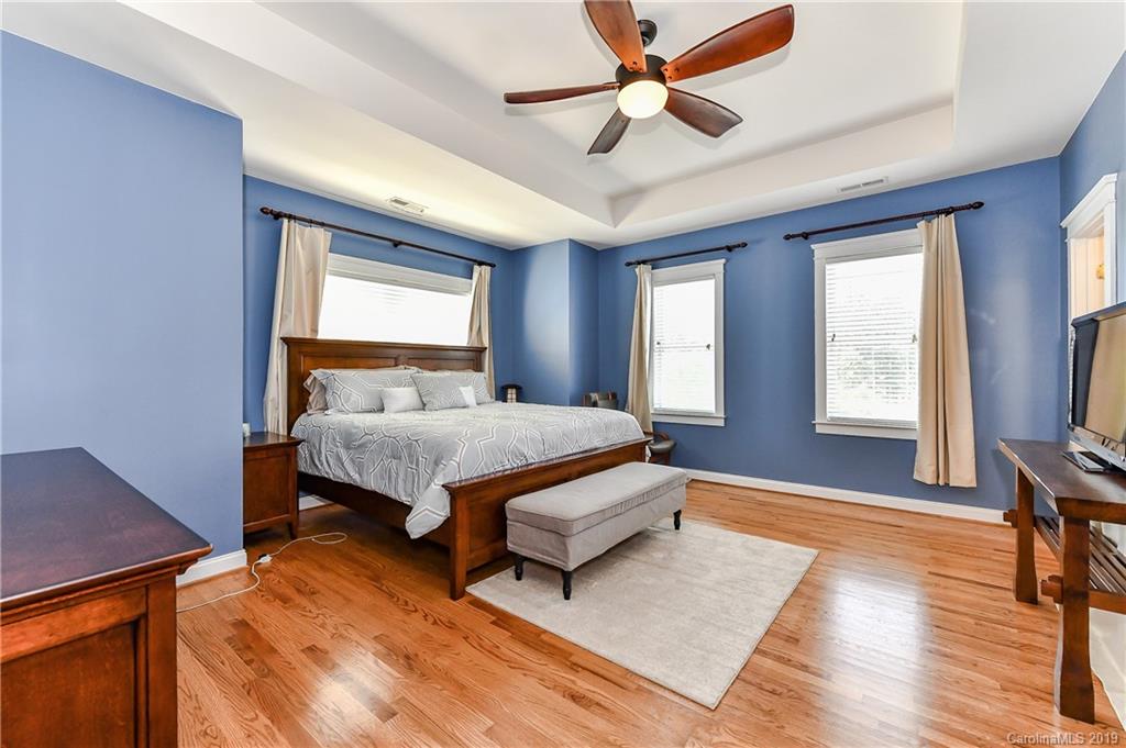 1036 Hunters Run Drive Tega Cay, SC 29708 - Photo 21 of 35 a bedroom with a bed and a window