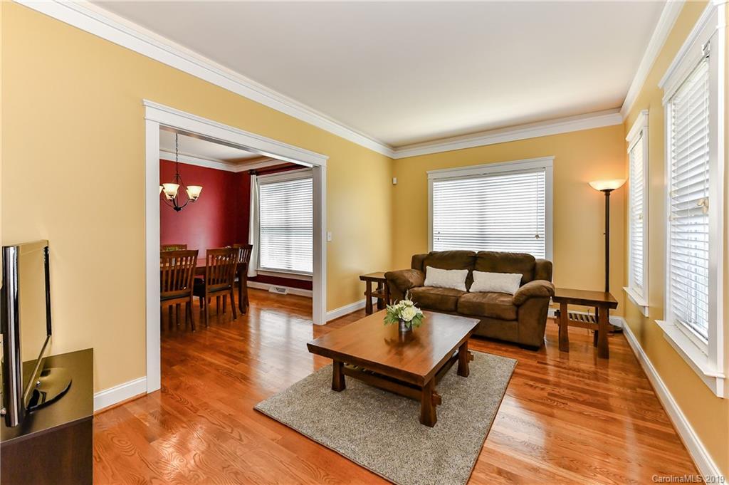 1036 Hunters Run Drive Tega Cay, SC 29708 - Photo 5 of 35 a living room with furniture and a wooden floor