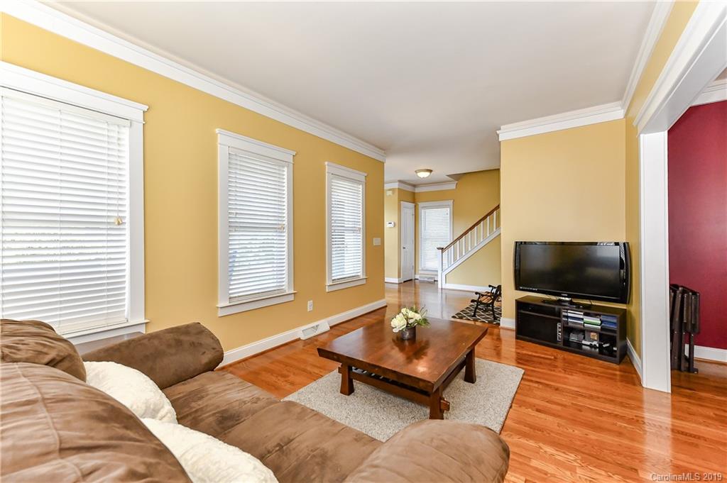 1036 Hunters Run Drive Tega Cay, SC 29708 - Photo 7 of 35 a living room with furniture and a flat screen tv