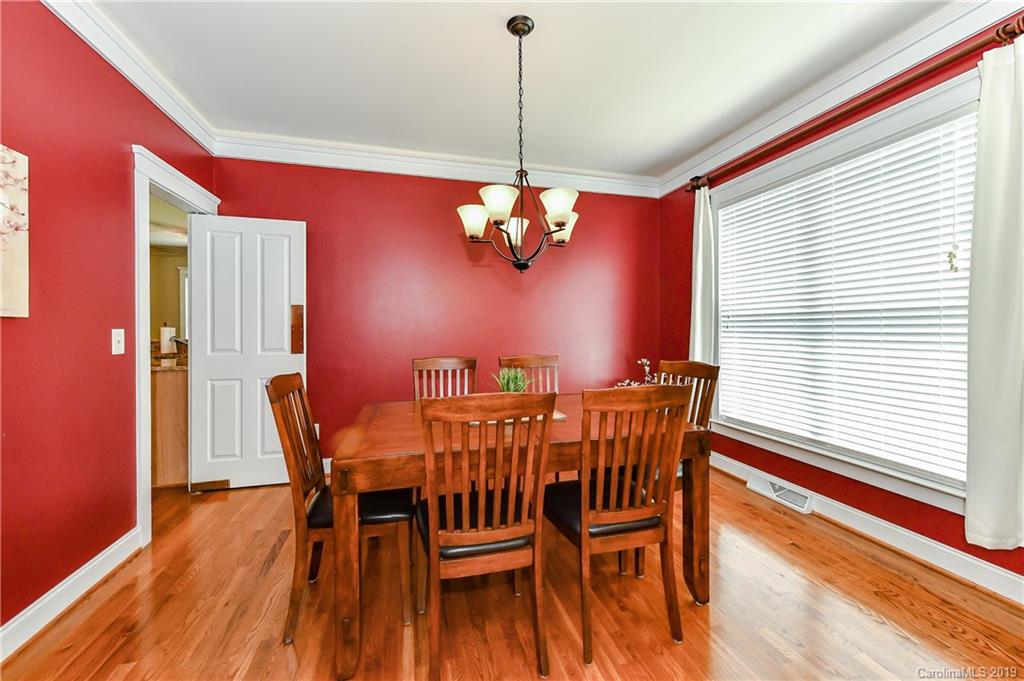 1036 Hunters Run Drive Tega Cay, SC 29708 - Photo 8 of 35 a view of a dining room with furniture and window