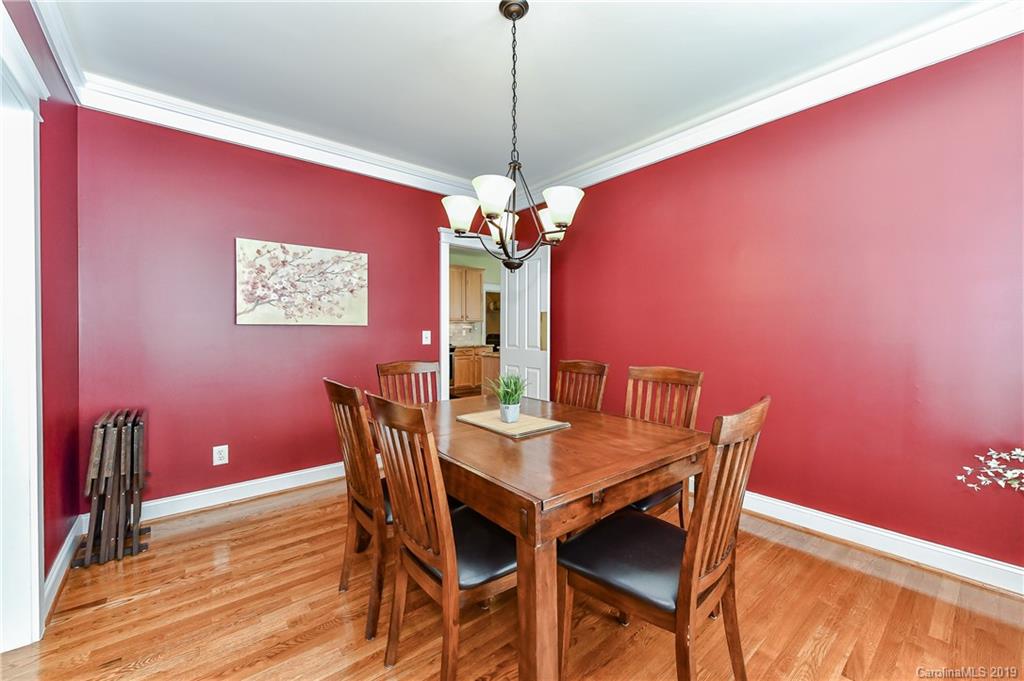 1036 Hunters Run Drive Tega Cay, SC 29708 - Photo 9 of 35 a dining room with furniture and window