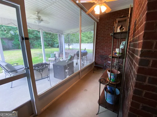a view of an chairs and table in a balcony