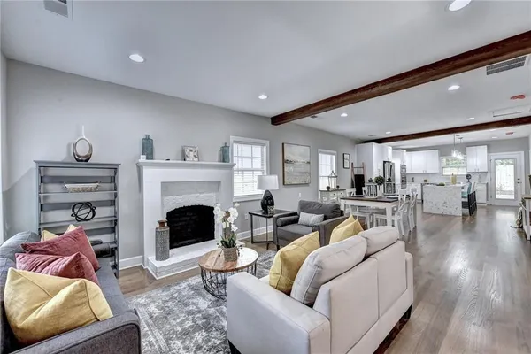 a living room with furniture and a fireplace