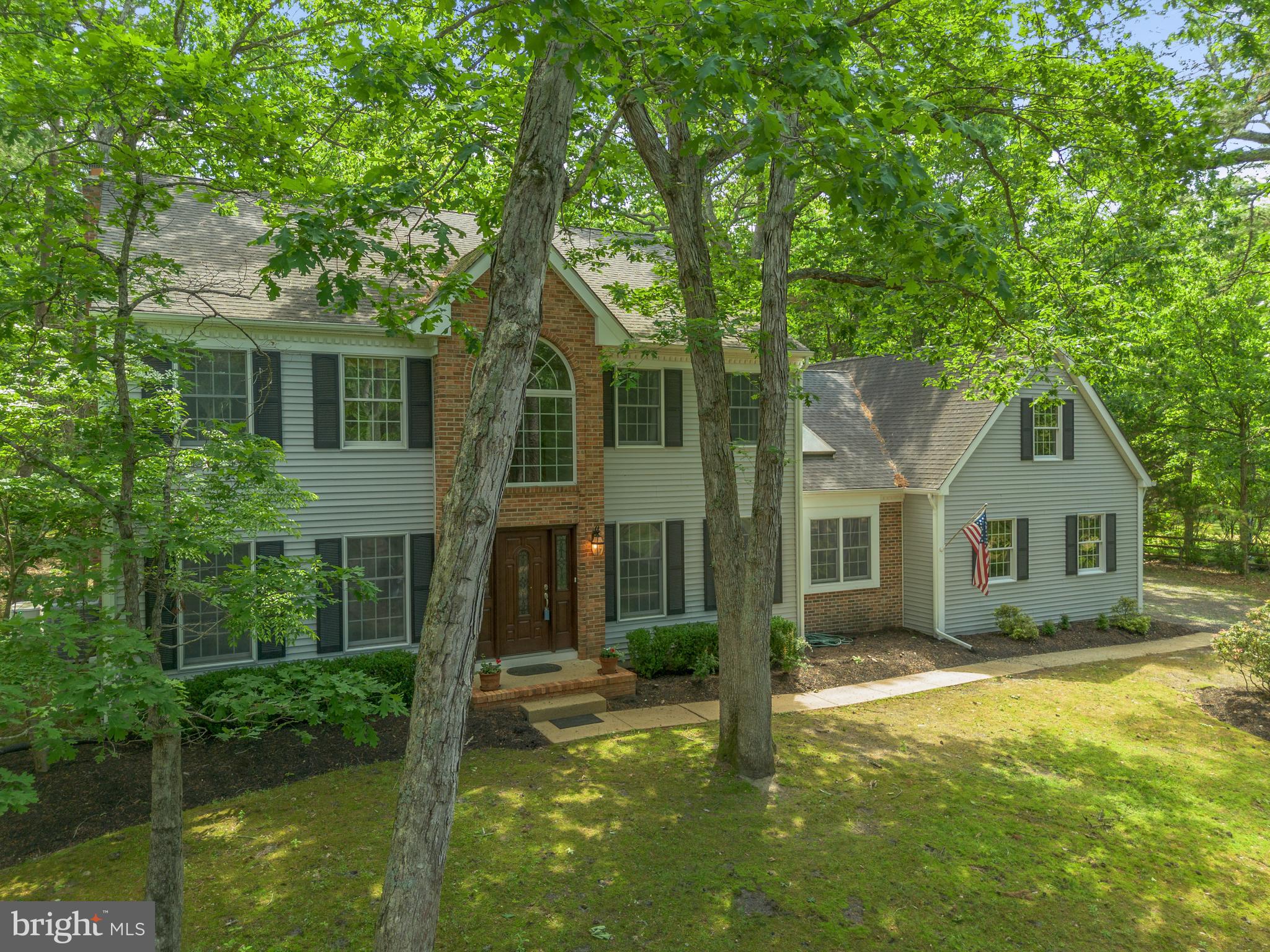 581 McKendimen Road Medford, NJ 08055 - Photo 1 of 34 front view of a house with a yard