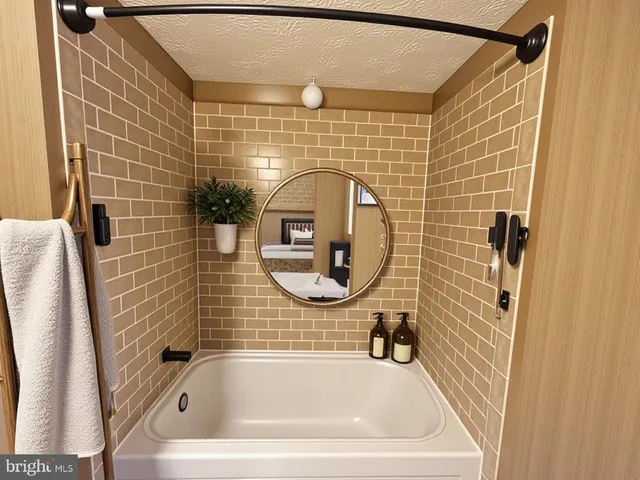 a bathroom with a sink a toilet and a shower