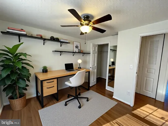 a workspace with furniture and wooden floor