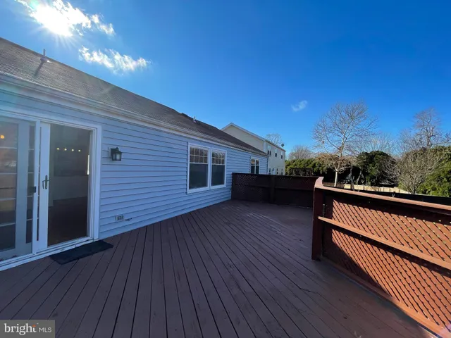 a view of a backyard with couches table and chairs