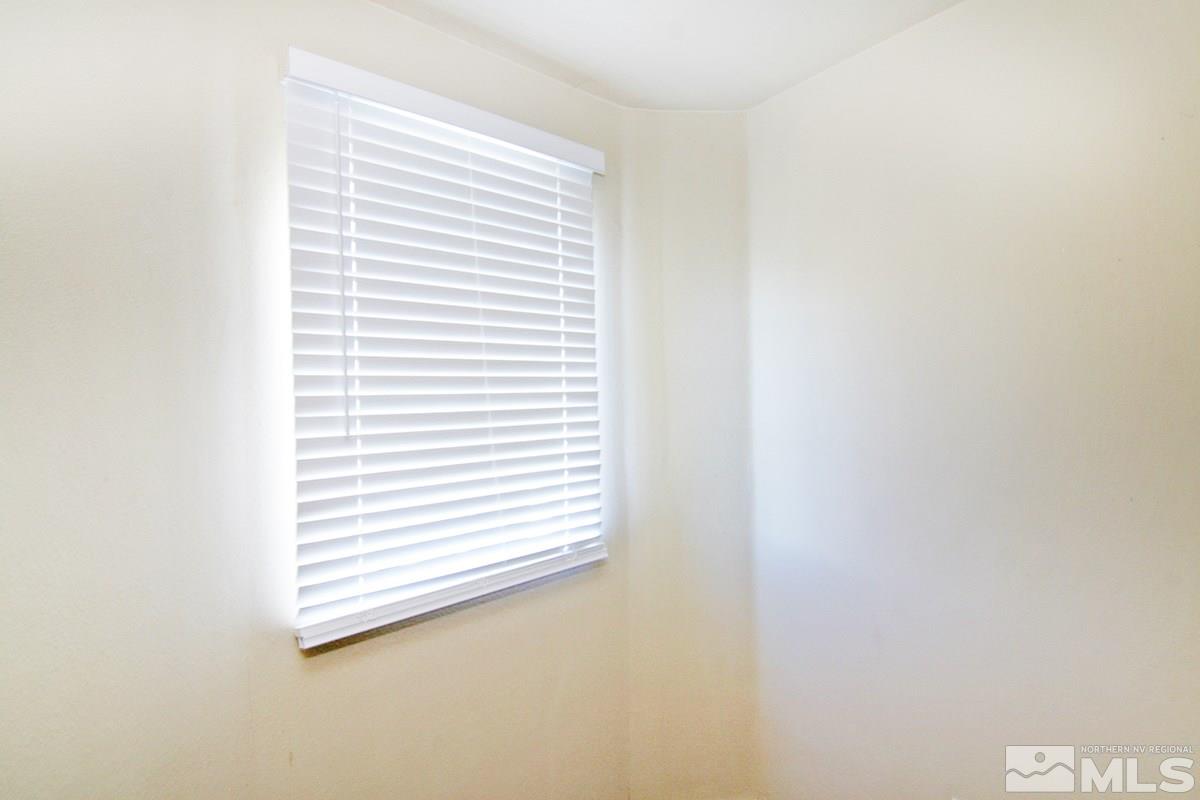 9050 Double R, Unit 225 Reno, NV 89521 - Photo 16 of 29 a view of a bedroom with a window