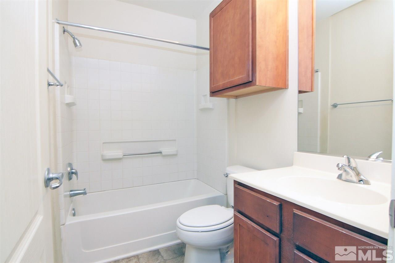 9050 Double R, Unit 225 Reno, NV 89521 - Photo 18 of 29 a bathroom with a sink a toilet and shower