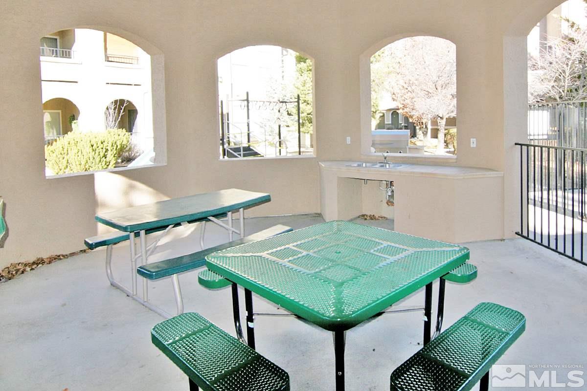 9050 Double R, Unit 225 Reno, NV 89521 - Photo 21 of 29 a view of a dining room with furniture and a window