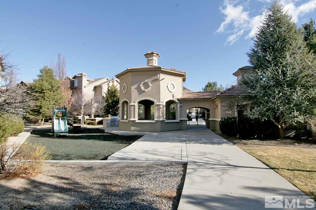 9050 Double R, Unit 225 Reno, NV 89521 - Photo 23 of 29 a view of a white house with a yard and plants