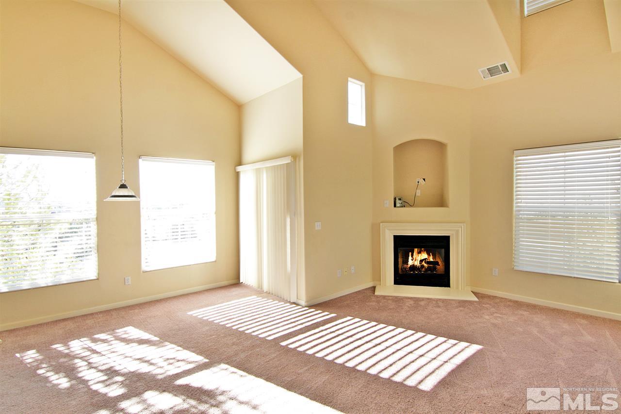 9050 Double R, Unit 225 Reno, NV 89521 - Photo 4 of 29 a view of livingroom with a fireplace