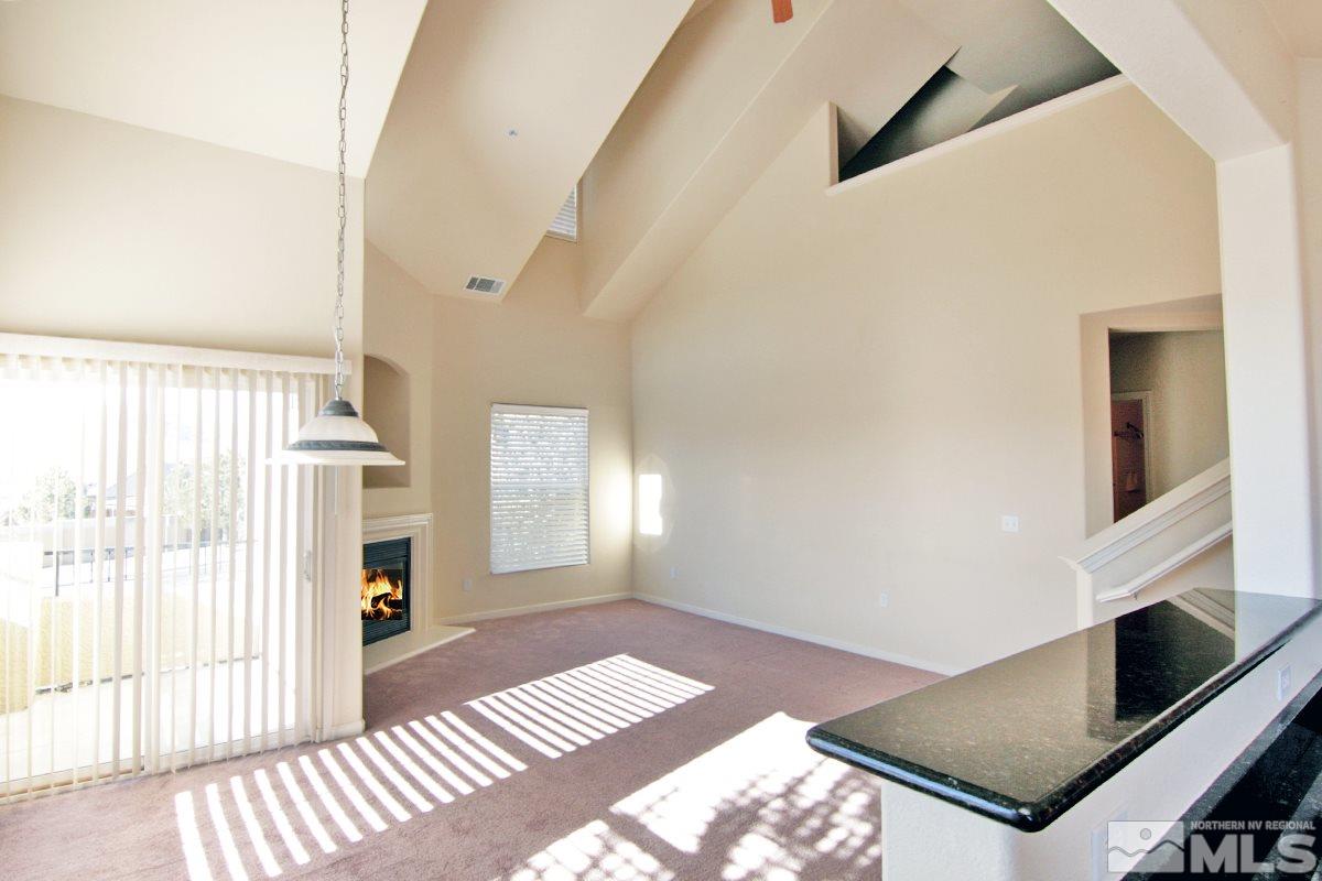 9050 Double R, Unit 225 Reno, NV 89521 - Photo 5 of 29 a view of a hallway with windows
