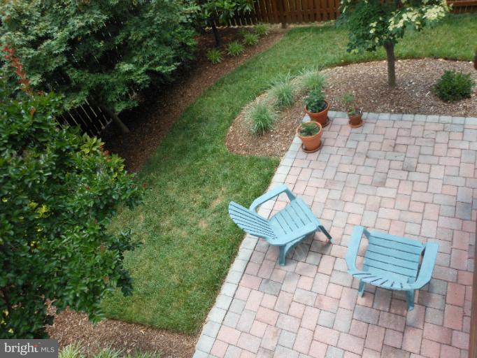 736 Howards Loop, Unit 43 Annapolis, MD 21401 - Photo 2 of 30 View from Main level decking down into gardens.